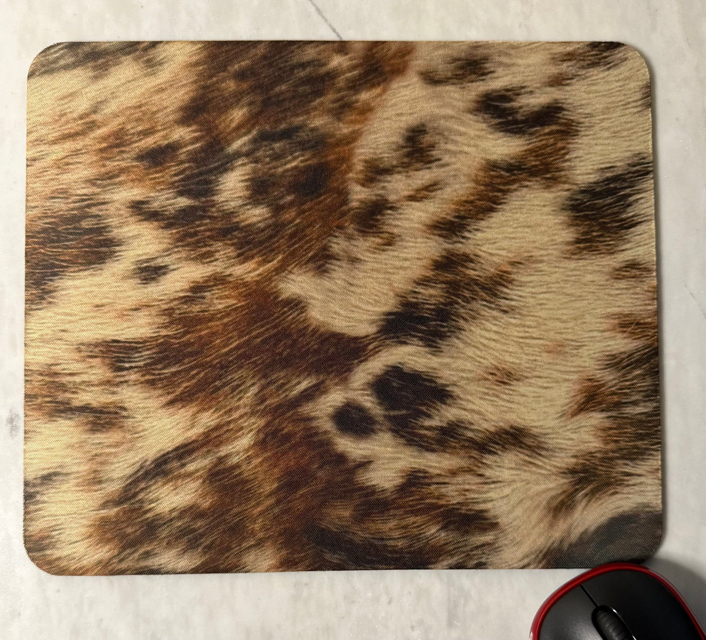 Mouse pad with a natural fur pattern.